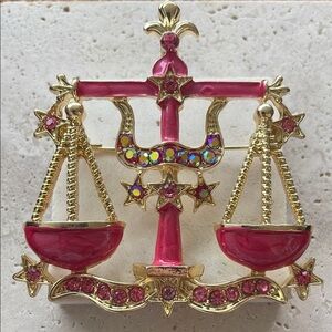 Anthropologie Gold and Pink Zodiac Brooch